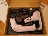 a box with a pair of black and white shoes in it