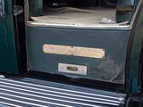 a close up of a green truck with a door open