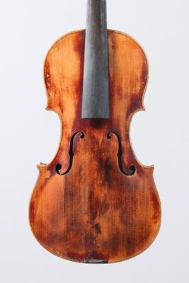 a close up of a violin on a white surface with a white background