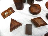 a table with a lot of wooden objects on it