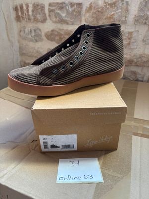a box that has a pair of shoes on top of it