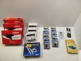 a lot of different types of electronic equipment on the table