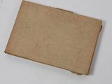 a brown cardboard box on a table with a white background