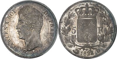 a close up of a coin with a crown on top of it