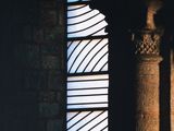 a book cover with a window in the middle and a light coming through it