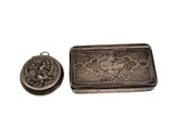an image of a small silver box with a picture on it