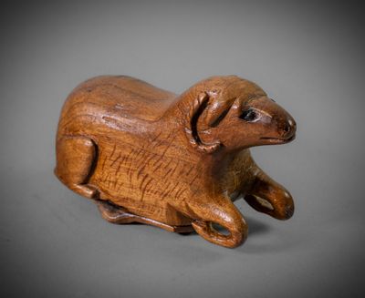 an image of a wooden animal figurine on a gray background