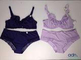 purple and purple lingersuits on a white table with a tag on it