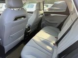 the back seats of a car are empty in a parking lot