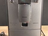 an image of a coffee machine on a wooden table