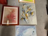 three paintings on the floor next to each other