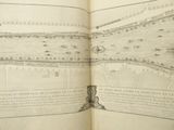 an open book with a drawing of a city on it