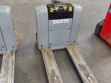 two forklifts that are sitting in a warehouse