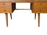 a wooden desk with two drawers on it