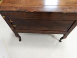 a small wooden table with a drawer on top of it