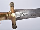 a person holding a very large knife in their hand