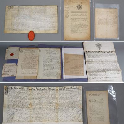 some old papers are on display on a shelf in a glass case