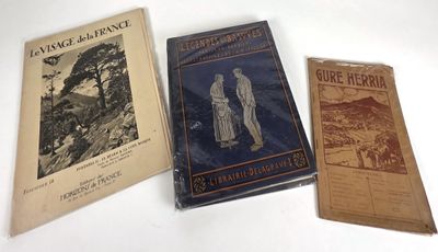 three books are sitting on a table with a white background