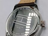 a close up of a wrist watch with a tennis court on it