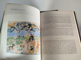 an open book with a picture of a horse and a dog on it