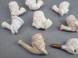 a lot of white figurines that are on a table