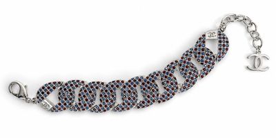 a close up of a bracelet on a white background