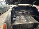 a car that has been burnt out in the street