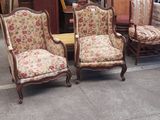 several chairs and a picture frame on the floor