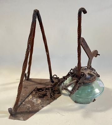a metal object that has been placed on a white surface