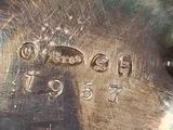 a close up of a silver plate with numbers on it