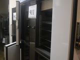 a refrigerator with a door open in a room