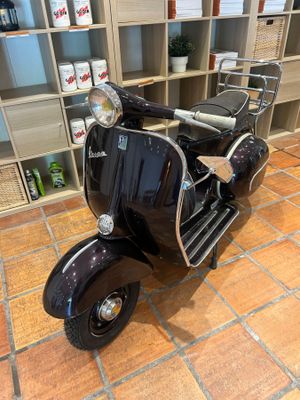 a motor scooter that is parked in a store