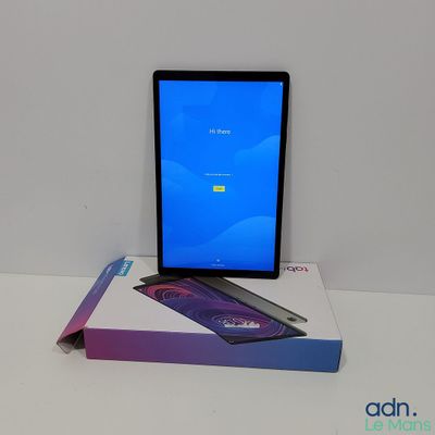 the tablet is sitting on top of a box on the table