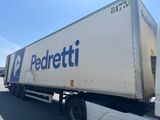 a large white truck that is driving down the street