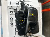 two walkie talkies that are sitting on top of a box