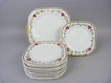 six pieces of porcelain plates with floral designs on them