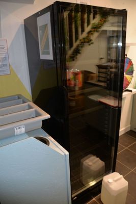 an image of a kitchen with a refrigerator and a sink