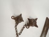 a pair of bells that are attached to a chain