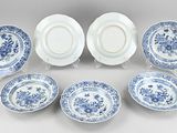 six blue and white plates with floral designs on them