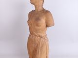 statue of a woman in a brown dress with a white background