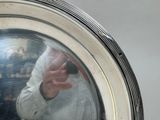 a man taking a picture of himself in the reflection of a mirror