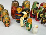 a lot of russian nesting dolls on a white surface