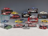 a lot of toy cars that are in a display case