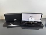 a box with a pen in it and a pen in it