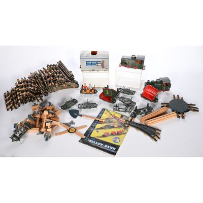 un assortiment de rails et d'accessoires pour trains miniatures, dont un livre