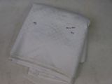 a white towel on a table with a white towel on it