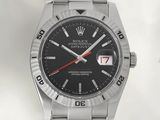rolex watch with a black dial and red second hand