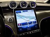 the dashboard of a car with a tablet on the dashboard