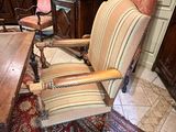 chairs and a table in a room with a rug on the floor