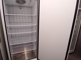 an image of a refrigerator with its door open in a kitchen